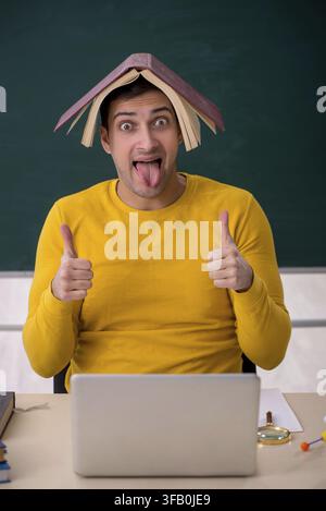 Young student sitting in classroom Stock Photo