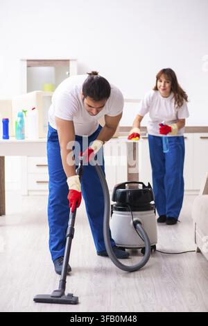 Young couple doing housework at home Stock Photo