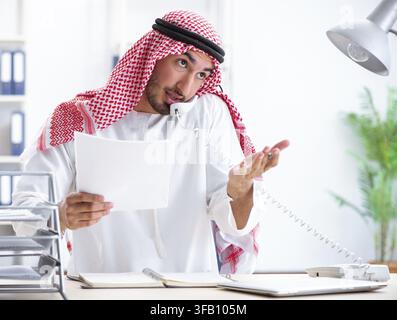 Arab businessman works in office Stock Photo