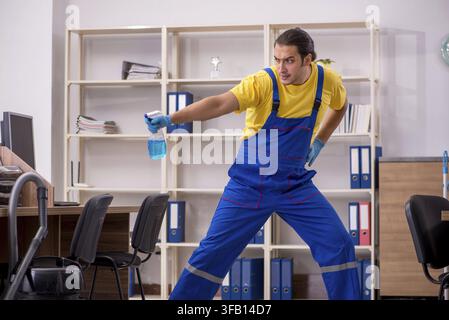 Male contractor cleaning office Stock Photo