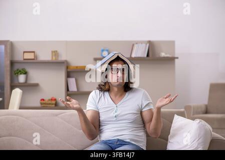 Young student preparing for exams at home Stock Photo