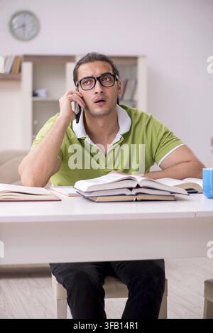 Young student preparing for exams at home Stock Photo