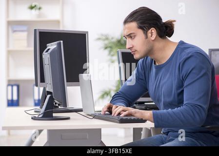 Young IT specialist working in an office Stock Photo