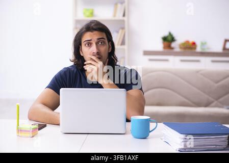 Young employee working from home Stock Photo
