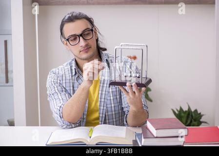 Male student preparing for exam at home Stock Photo