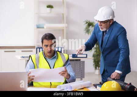 Two architects working in an office Stock Photo