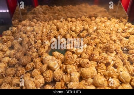 Caramel popcorn displayed in glass container. Stock Photo