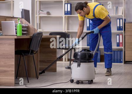 Male contractor cleaning office Stock Photo