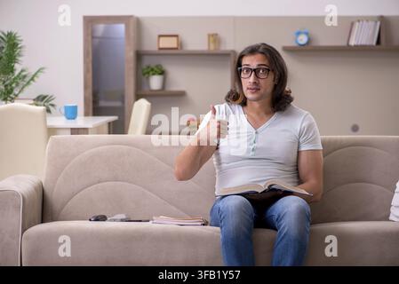 Young student preparing for exams at home Stock Photo
