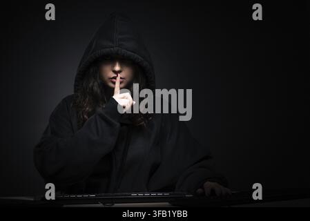 The hacker who hacks the security firewall late in office Stock Photo
