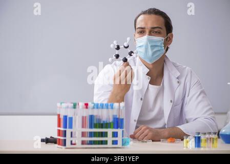 Young chemist working in laboratory Stock Photo