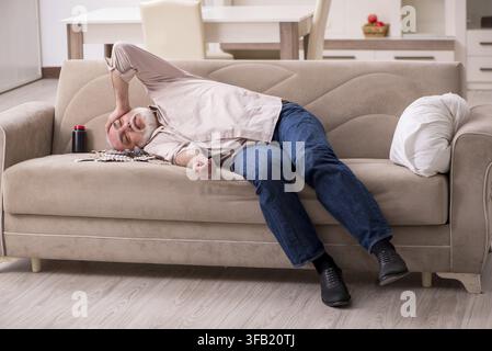 Old man is suffering at home Stock Photo
