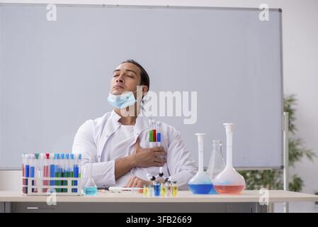 Young chemist working in laboratory Stock Photo