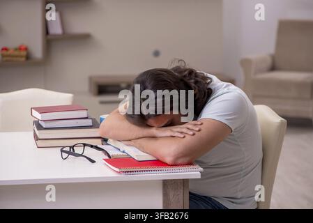 Young student preparing for exams at home Stock Photo