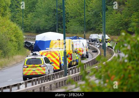 Police officers at the scene of a fatal crash involving a police car and a Volkswagen Passat on the A66 in South Bank, near Middlesbrough. An investigation has been launched into a crash which killed several people following a police pursuit in the early hours of Saturday morning, the police watchdog said. Picture date: Saturday August 22, 2026. Stock Photo