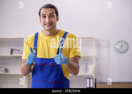 Male contractor cleaning office Stock Photo