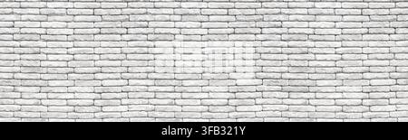 White brick wall creating a uniform texture and abstract background Stock Photo