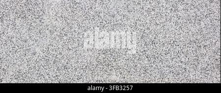 Granite stone surface showcasing a speckled grey and black mineral texture Stock Photo
