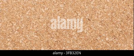 Cork board surface showing natural warm brown texture for backgrounds and design Stock Photo