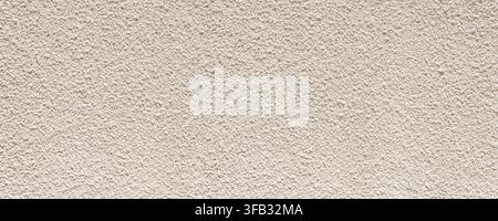 Stucco wall presenting a rough textured surface pattern Stock Photo