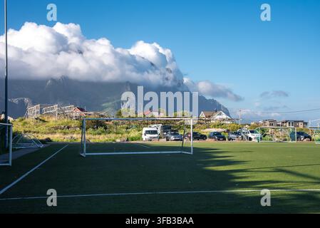 Henningsvaer Football Stadium with mountain clouds in Lofoten Norway Stock Photo