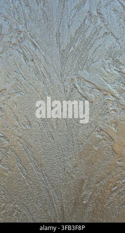 Textured Wall Surface with Raised Feather Like Plaster Pattern Close Up Stock Photo