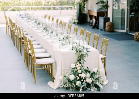 Elegant outdoor wedding reception table with floral decor Stock Photo