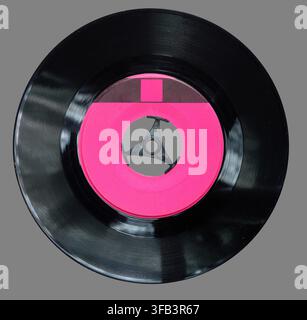 Vinyl 7 45 rpm inch record with a blank label isolated on neutral grey background stock photo Stock Photo