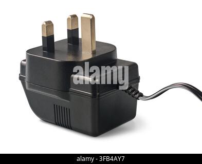 black uk power adapter plug isolated white background, three brass pins and attached electrical wire cord, electrical equipment in side view Stock Photo