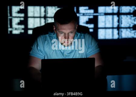 Developer works on secure software. Developer writes protection code system. Developer analyzes network vulnerabilities. Developer prevents cyber Stock Photo