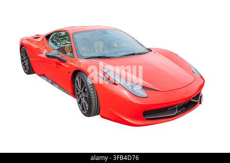 Red sports car isolated on white background, showcasing sleek design, aerodynamic body, glossy finish, high-quality material, luxurious interior, blac Stock Photo