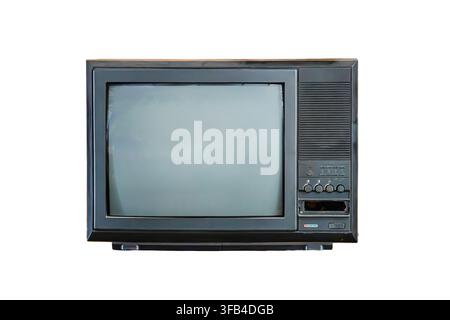 Vintage television set isolated on white background, featuring rectangular bulky design, manual control knobs, black matte surface, high contrast pres Stock Photo