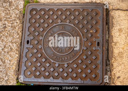 Square Cast Iron Manhole Cover with Inscription Commune di Verona on Pavement Street in Italy. Verona, Italy - June 25, 2026 Stock Photo