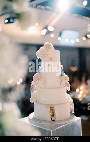 Elegant Four Tier Wedding Cake with Floral Decorations in Toronto Venue Stock Photo
