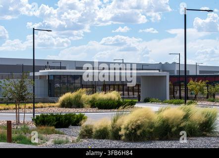 Eagle Mountain, Utah, USA. 22nd Aug, 2026. A security checkpoint building sits near an electrical substation at the Meta Eagle Mountain Data Center campus in Eagle Mountain, Utah, United States, on August 21, 2026. The industrial infrastructure facility comprises multiple large-scale technological buildings designed to house computing servers and process global network data traffic for Facebook's parent company, Meta Platforms, Inc. (Credit Image: © Charles McClintock Wilson/ZUMA Press Wire) EDITORIAL USAGE ONLY! Not for Commercial USAGE! Stock Photo