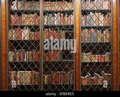 Bookcase of old books in the Morgan Library Stock Photo