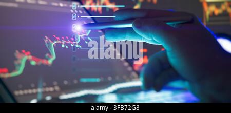 Executing investment goals. Businessman checking off tasks on a virtual interface while analyzing cryptocurrency data on laptop. Stock Photo