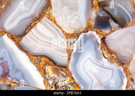 Agate Grey unique semi precious stone texture with a gold leaf for luxury interior design. Stock Photo