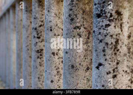 A vertical perspective showing a rough dark volcanic rock formation ...