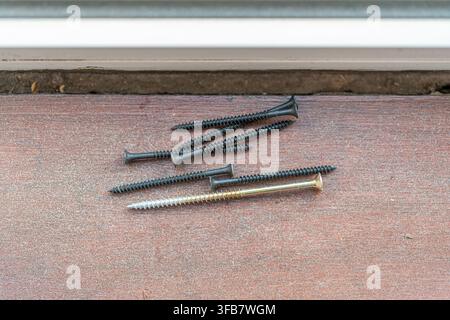 Assorted carpentry tools on wooden floor during renovation Stock Photo