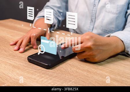 A woman searching for files or folders on his smartphone Stock Photo
