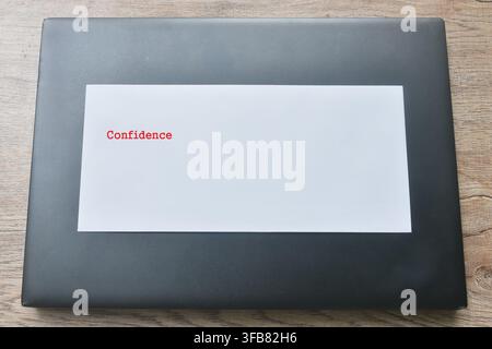 white envelope with red confidence letter arranging on black laptop Stock Photo