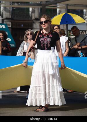 MADRID, SPAIN - AUGUST 23: Members of the Ukrainian community gathered at Puerta del Sol in Madrid and marched through the streets of the city to Plaza de Cibeles in commemoration of Ukrainian Flag Day and the 35th anniversary of Ukraine's independence. Credit: Aaron Heredia Sánchez/Alamy Live News Stock Photo