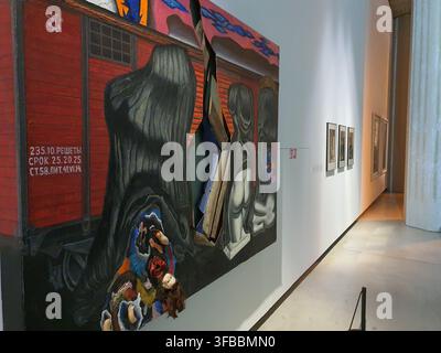 A large contemporary mixed-media painting displayed on a white wall in a modern art gallery or museum interior. The artwork depicts a red Soviet-era Stock Photo