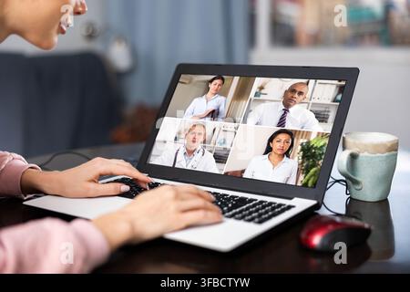 Woman having video conference with colleagues Stock Photo