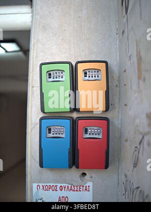 Key safe boxes mounted on a concrete wall Stock Photo