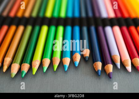 close-up of vintage colored pencils set neatly stored in pencil case, focus of the tips from 30 years old pencils, concept of creativity, drawing, edu Stock Photo