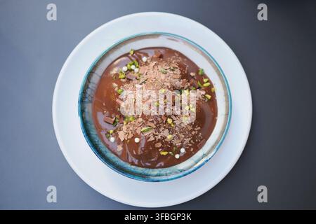 Delicious dessert served in a bowl with toppings Stock Photo