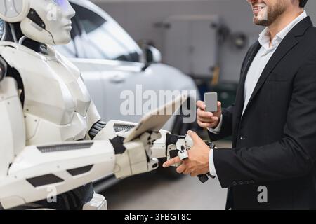 Man Shakes Hands With Robot Stock Photo