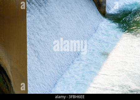 Powerful waterfall rushing over rocky ledge with turquoise water in Turkey Stock Photo